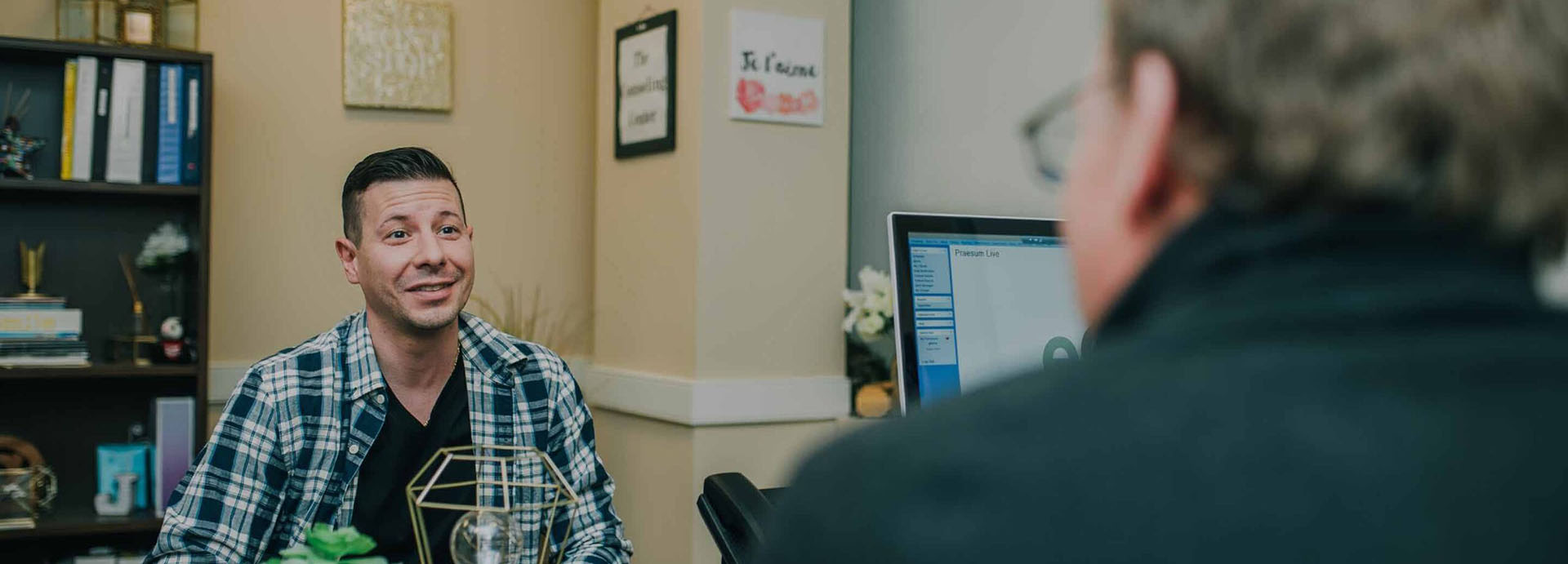 A man talking with a counselor at The Counseling Center