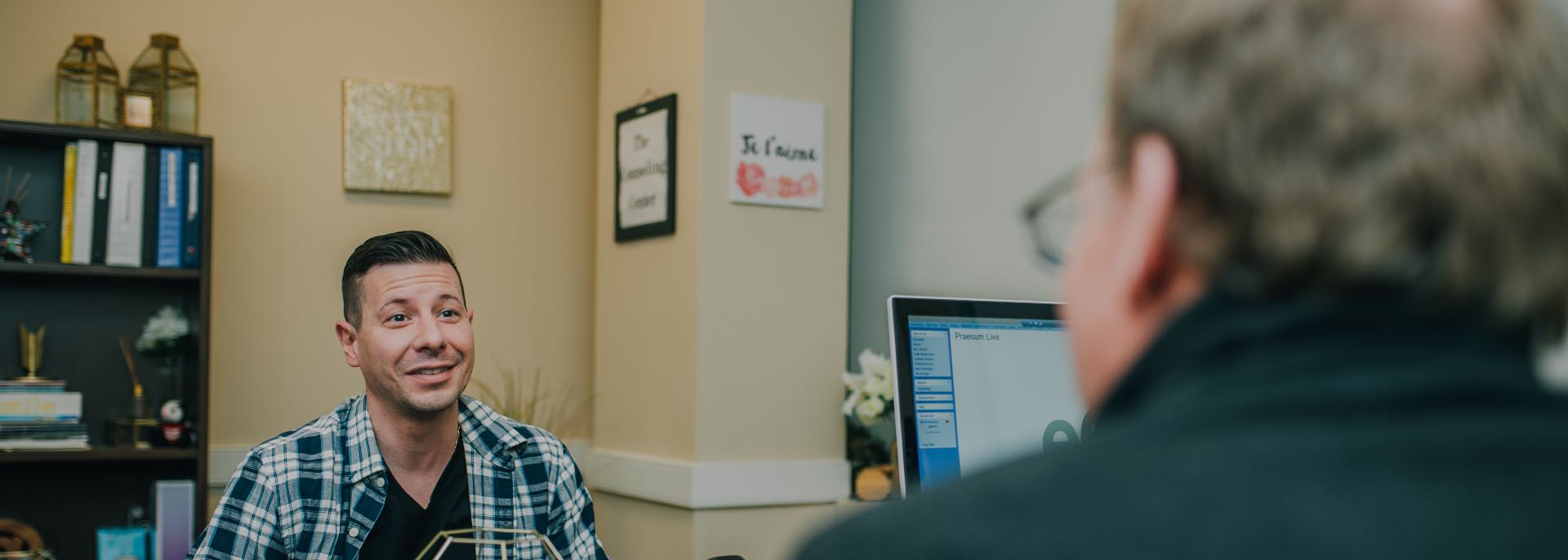 man sitting down with consoler