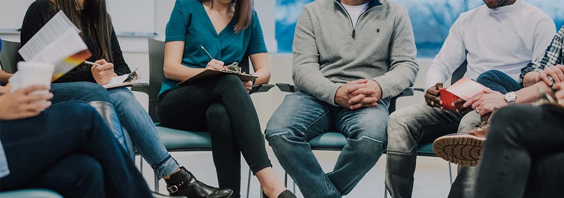 people sitting down in a group meeting