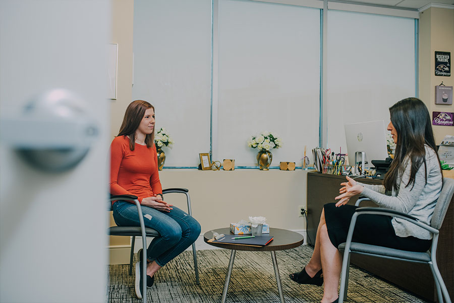 woman speaking with consoler